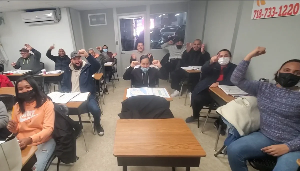 Millennium Driver's Academy students celebrating after class